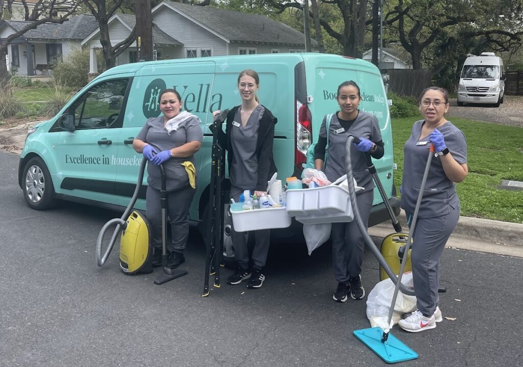 A team of house cleaners with supplies A team of house cleaners with supplies and a branded van, ready for house cleaning with pets.